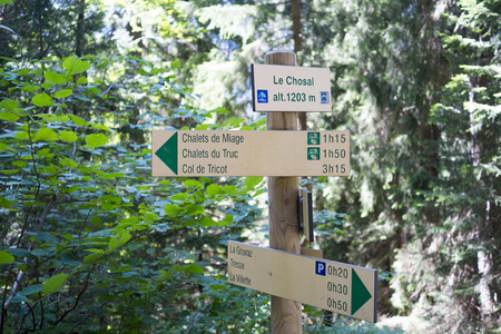 LE CHOSAL, FRANCE - AUGUST 24: Tour du Mont Blanc direction signs. The popular tour goes through France, Italy and Switzerland, and is clearly signalised throughout. August 24, 2014 in Le Chosal.のeditorial素材