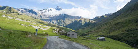 VILLE DES GLACIERS, FRANCE - AUGUST 27: Panoramic of chalets with Glacier Needles. The region is a stage at the Mont Blanc tour, which crosses three countries. August 27, 2014 in Ville des Glaciers.のeditorial素材