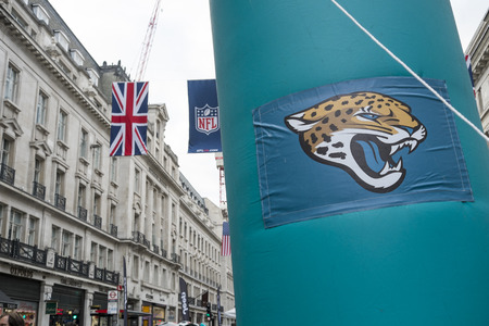 LONDON, UK - SEPTEMBER 27: Jacksonville Jaguars banner and NFL flags above in Regent Street. September 27, 2014 in London. The street was closed to traffic to host NFL related games and events.のeditorial素材