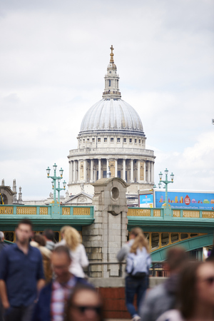 LONDON, UK - JUNE 23: Dome of Saint Paul's cathedral seen from Blackfriars, with blurred people in the foreground. June 23, 2015 in London.のeditorial素材