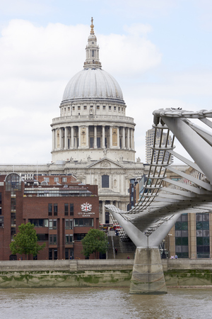 LONDON, UK - JUNE 23: Dome of Saint Paul's cathedral, with Millennium Bridge in the foreground. June 23, 2015 in London.のeditorial素材