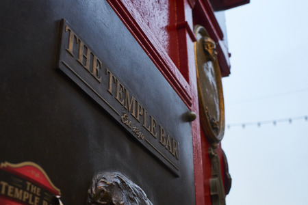 DUBLIN, IRELAND - JANUARY 05: Low angle shot of emblematic Temple Bar pub plaque, in the area of the...