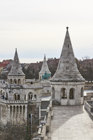 BUDAPEST, HUNGARY - FEBRUARY 02: Cropped shot of Fisherman's Bastion's spires, with statue of Saint Stephen in the background. February 02, 2016 in Budapest.のeditorial素材