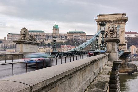BUDAPEST, HUNGARY - FEBRUARY 02: Motion blurred traffic over Szchenyi Chain Bridge with Buda Castle in the background. February 02, 2016 in Budapest.のeditorial素材