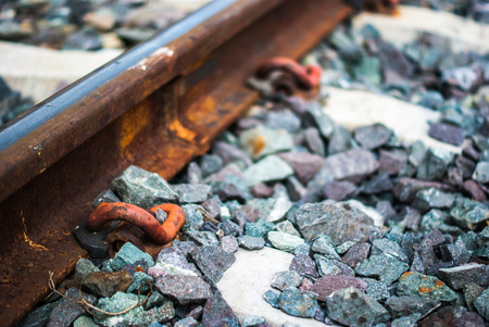 Train rail with stone backgroundの写真素材