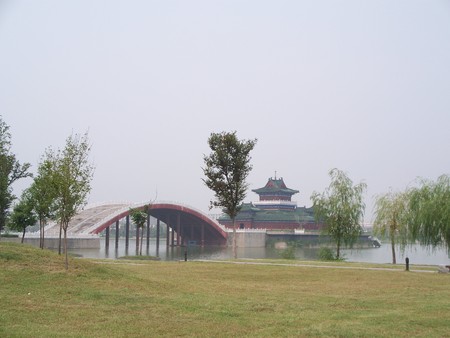 Park with traditional Chinese building and bridgeの写真素材