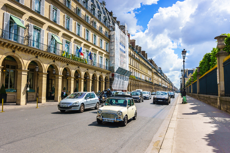 Paris, France - May 2, 2017: Traffic conditions on Rivoli street and the beautiful old architecture along the way with a cloudy background on May 2, 2017, in Paris, France.のeditorial素材