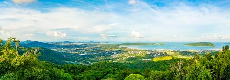 Beautiful nature panorama high angle view of Chalong Bay and cityscape of Phuket island in the evening with cloudy blue sky background.の写真素材