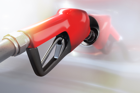 3d rendering of red gasoline dispenser refueling to a white car with sunlighting.の写真素材