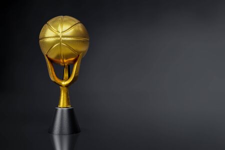 3d rendering of the basketball golden trophy on dark background studio shot with clipping paths.の写真素材