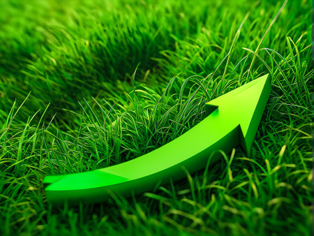 a green arrow pointing up in the grass with a green background, a sustainable business concept,の素材