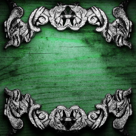 iron ornament on wood made in 3Dの写真素材