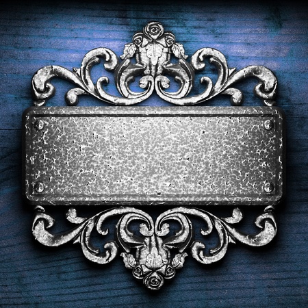 iron ornament on wood made in 3Dの写真素材
