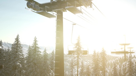 empty ski lift. chairlift silhouette on high mountain over the forest at sunsetの写真素材
