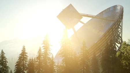 The observatory radio telescope in forest at sunsetの写真素材