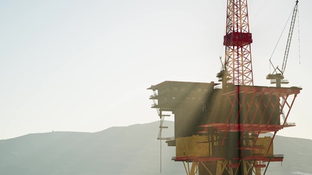 An offshore oil platform at sunset lightの写真素材