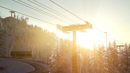 empty ski lift. chairlift silhouette on high mountain over the forest at sunsetの写真素材