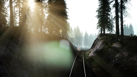 Flight Over A Railway Surrounded By Forest with Sunbeamsの写真素材