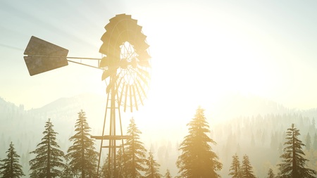 Typical Old Windmill turbine in forest at sunsetの写真素材