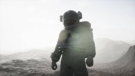 astronaut on another planet with dust and fogの写真素材