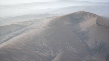 aerial of the red sand desert dunes in fogの写真素材