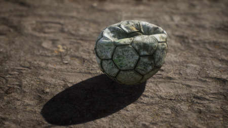 Old soccer ball the cement floor