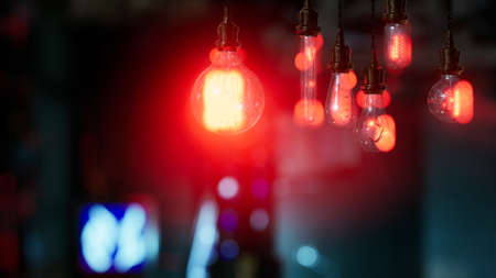 old retro vintage incandescent light bulb. loft style. ideas concept. bokeh background and copy...