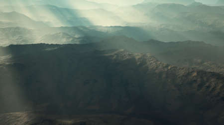 aerial vulcanic desert landscape with rays of lightの写真素材