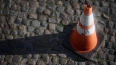 orange and white striped traffic coneの写真素材