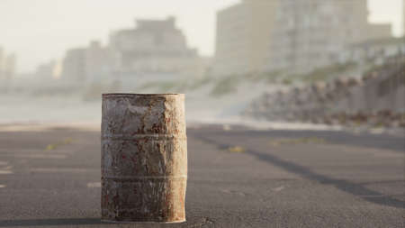 old rusty metal barrel on the streetの写真素材