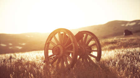 historic war gun on the hill at sunsetの写真素材