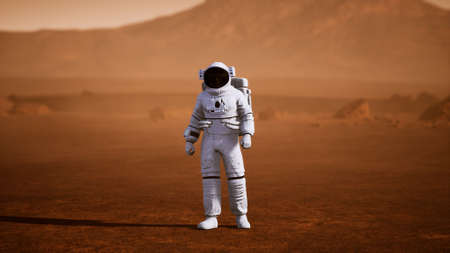 Astronaut on Mars Surface. Red Planet Covered in Gas and rockの写真素材