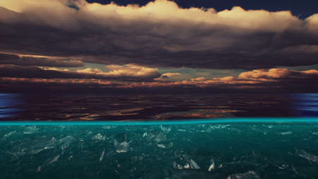 Split view over and under water in the Caribbean sea with clouds