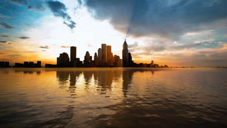 Skyline with skyscrapers and sea at sunsetの写真素材