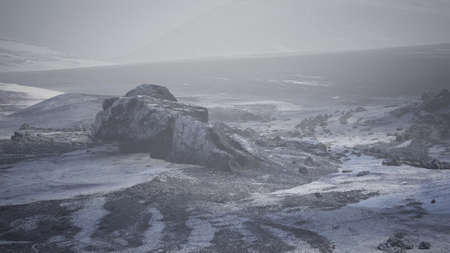 Antarctic mountains with snow in fog