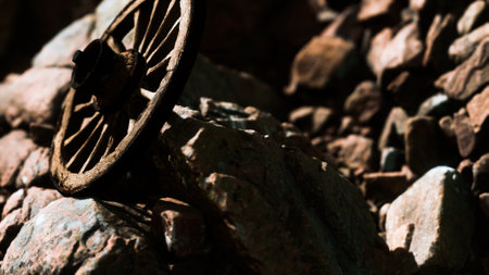 old wooden wheel on rocksの写真素材