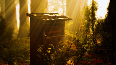 Old wooden beehive in forest in fogの写真素材