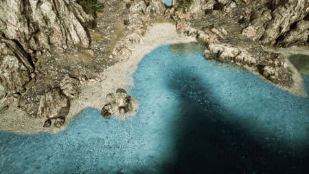 aerial view from flying drone of rocky island in Atlantic oceanの写真素材