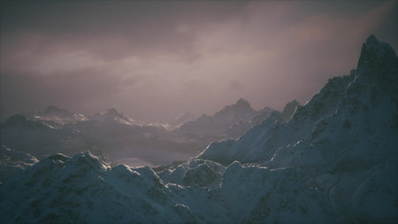 Snow covered peaks rise dramatically against a twilight sky, creating a serene and picturesque...