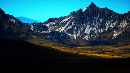 Snow capped peaks tower above rugged landscapes, casting long shadows as the sun sets, illuminating the undulating terrain with warm hues. The scenery reflects nature grandeur in tranquility.の写真素材