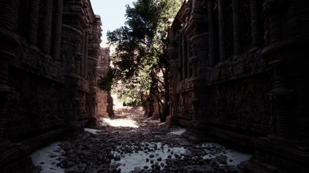 A narrow alleyway with snow-covered ground and trees lining the sides.の写真素材