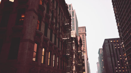 Tall buildings rise into the sky, revealing intricate architectural details along the bustling...