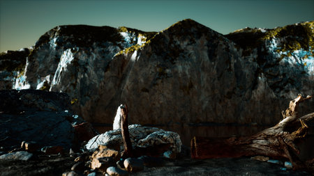 Morning light illuminates towering cliffs beside a tranquil water body, creating an enchanting landscape.の写真素材