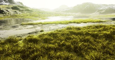 Vibrant green vegetation spreads across a tranquil landscape alongside a calm body of water. Sunlight bathes the scene, highlighting the serene beauty of nature.の写真素材