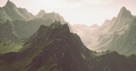 Breathtaking peaks tower majestically as sunlight bathes the rugged landscape. Valleys stretch below, creating a serene atmosphere amidst natures grandeur. A hidden world unfolds in the distance.の写真素材