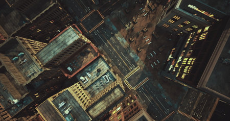 A stunning aerial perspective captures a bustling city at dusk, where vibrant lights illuminate the streets below. Towering buildings and intersecting roads create a dynamic urban tapestry.の写真素材