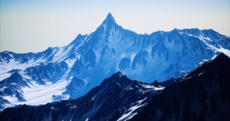 A majestic snow covered peak rises into the clear blue sky, surrounded by rocky terrain and other...