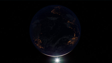 A captivating view of Earth from space reveals city lights twinkling across continents as night...