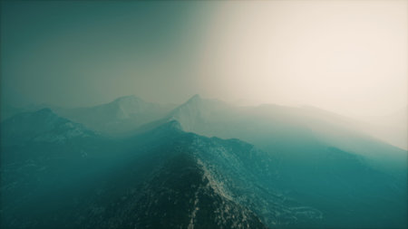 Faint silhouettes of mountains rise against a muted twilight sky, enveloped in mist. A tranquil...