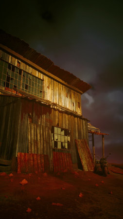 A barn stands with a red tint visible on its side, contrasting against the surrounding landscape.
